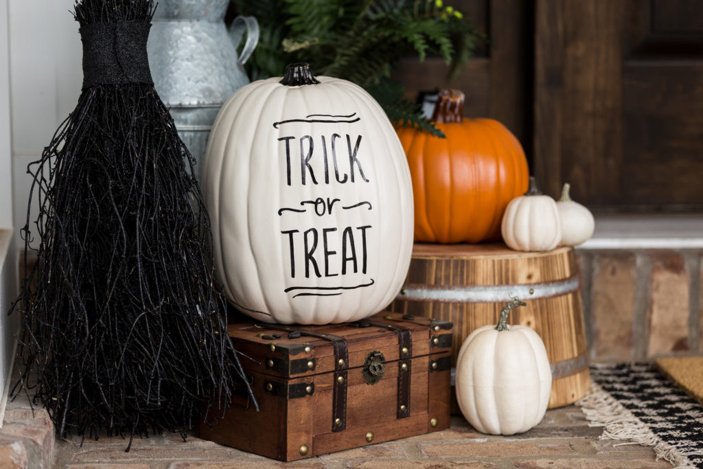 Pumpkins on doorstep with "Trick or treat" in vinyl decals